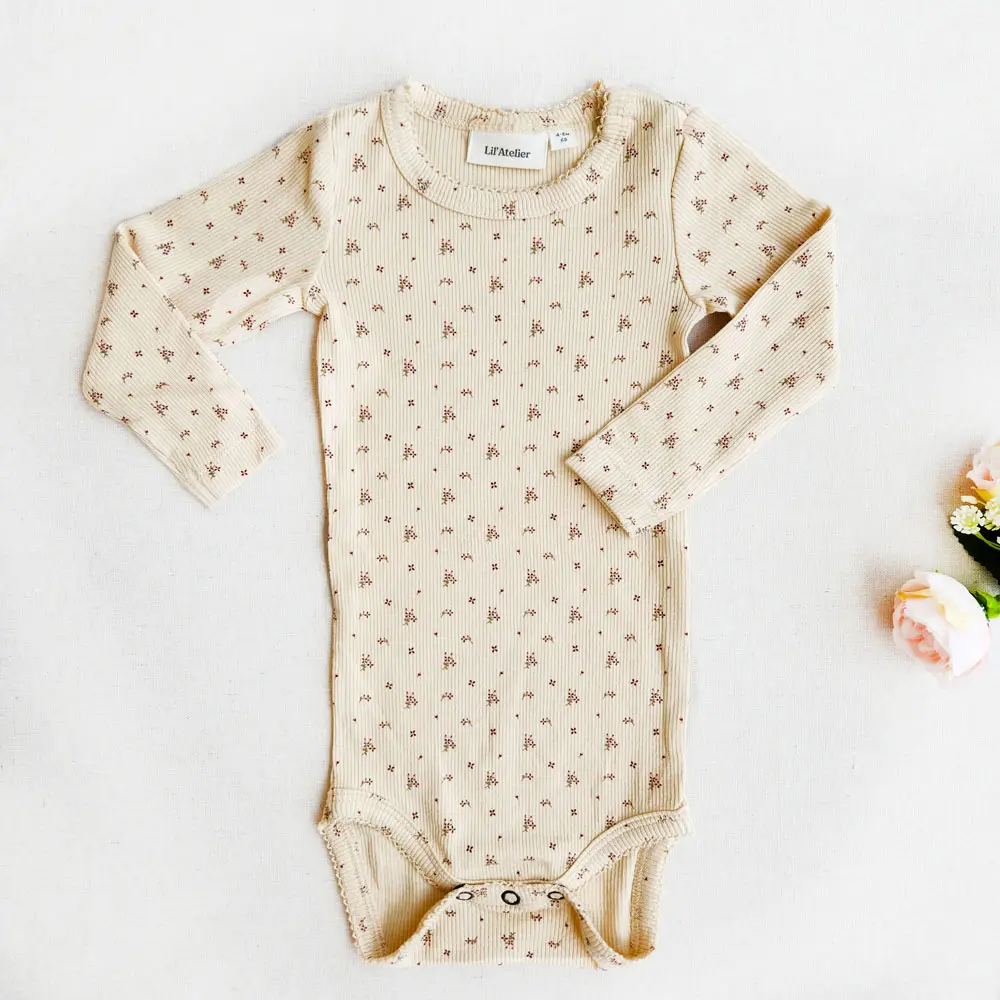 بادی دخترانه آستین بلند کبریتی طرح گل 4 پر برند Lil Atelier