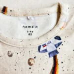 خرید بادی پسرانه آستین بلند طرح موشک رنگ کرم برند name it