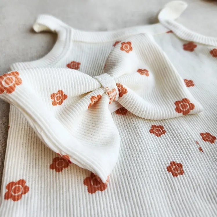 ست تاپ و شورتک و هد بند دخترانه طرح شکوفه