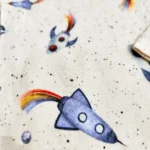 قیمت بادی پسرانه آستین بلند طرح موشک رنگ کرم برند نیم ایت