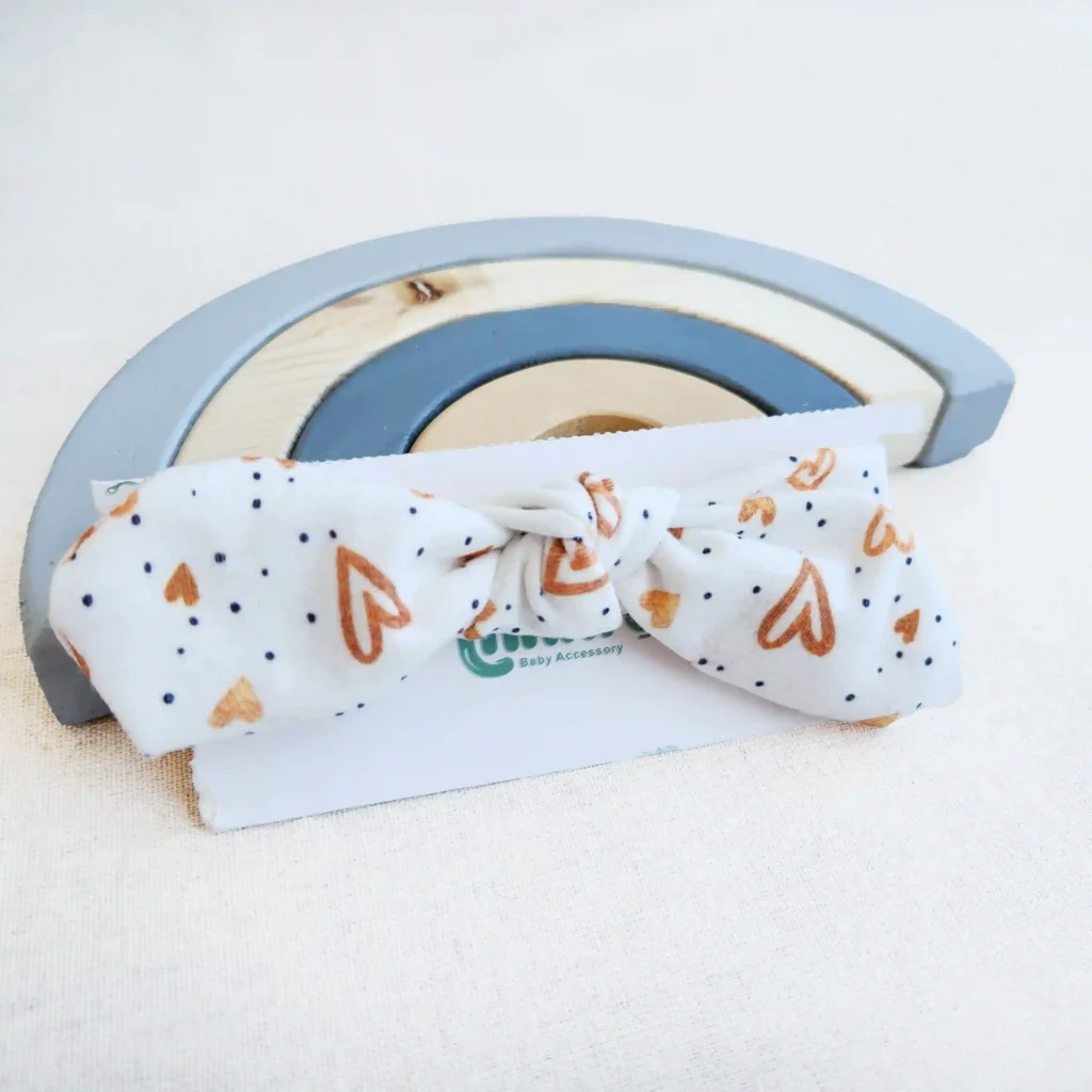 هدبند دخترانه طرح قلب های طلایی