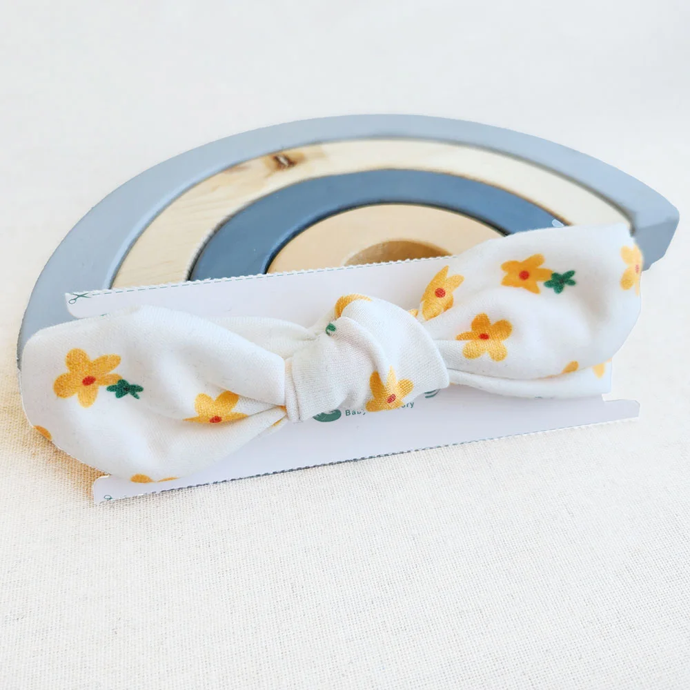 هدبند دخترانه طرح گل های زرد