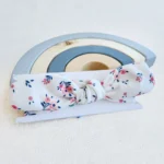 هدبند دخترانه طرح گل های صورتی سرمه ای