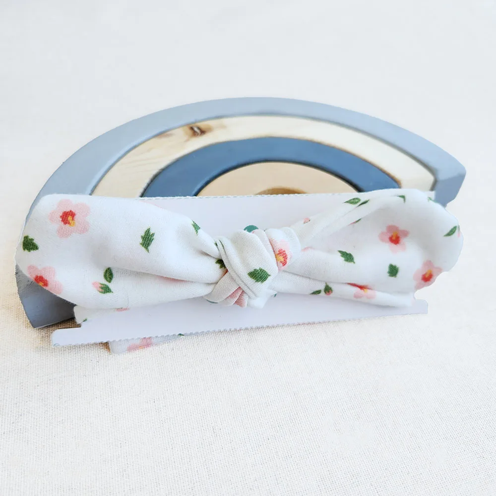 هدبند دخترانه طرح گل های صورتی