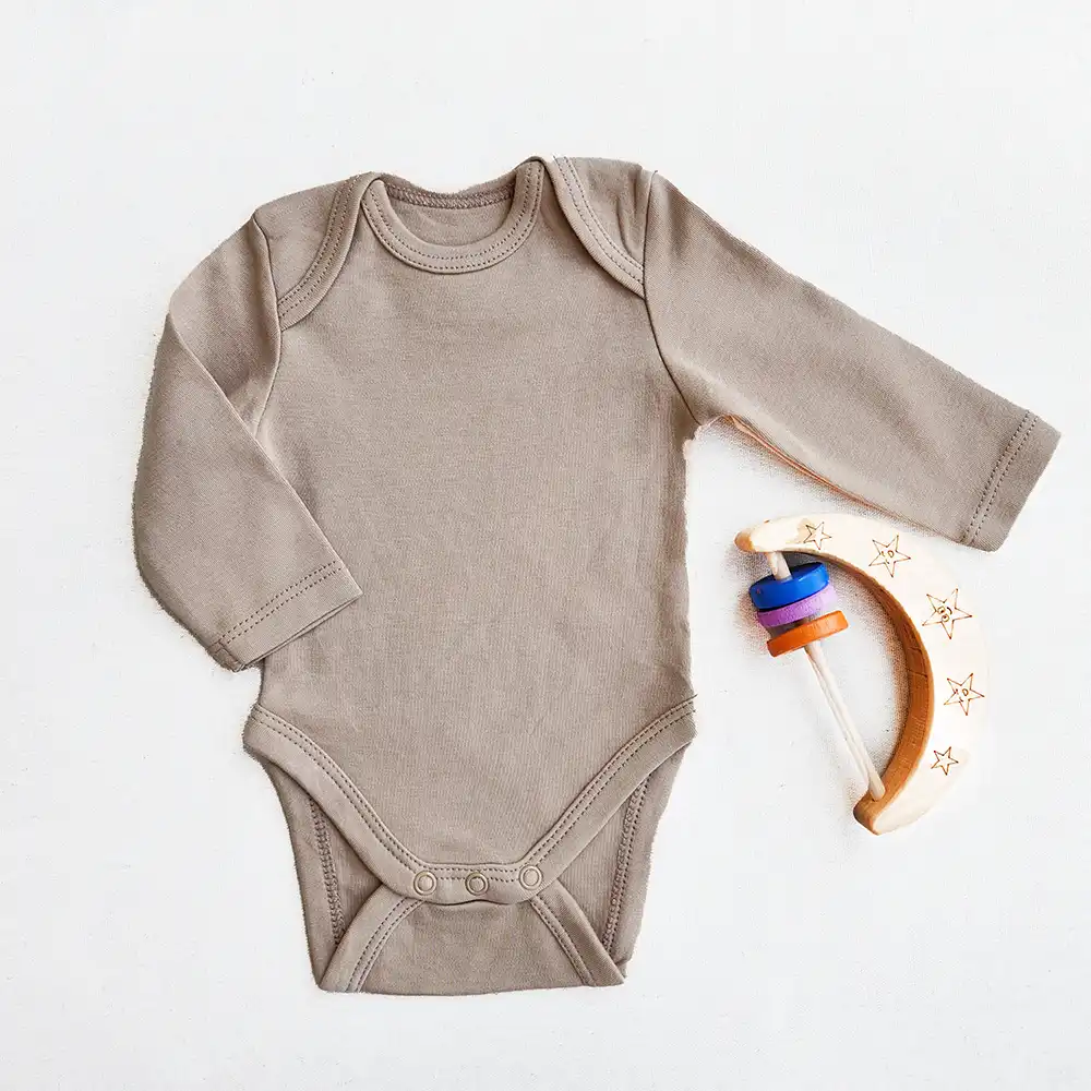 بادی آستین بلند وارداتی ساده رنگ کرم برند C&A