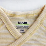 بادی آستین کوتاه وارداتی جلو دکمه دار راه راه رنگ سفید و زرد برند Kiabi