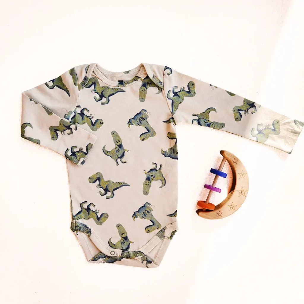 بادی آستین بلند طرح دایناسور عروسکی رنگ کرم برند HEMA