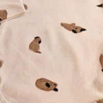 بادی آستین بلند طرح هاپوهای بامزه کرم برند HEMA