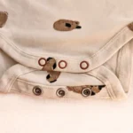 بادی آستین بلند هاپوهای بامزه رنگ کرم برند HEMA