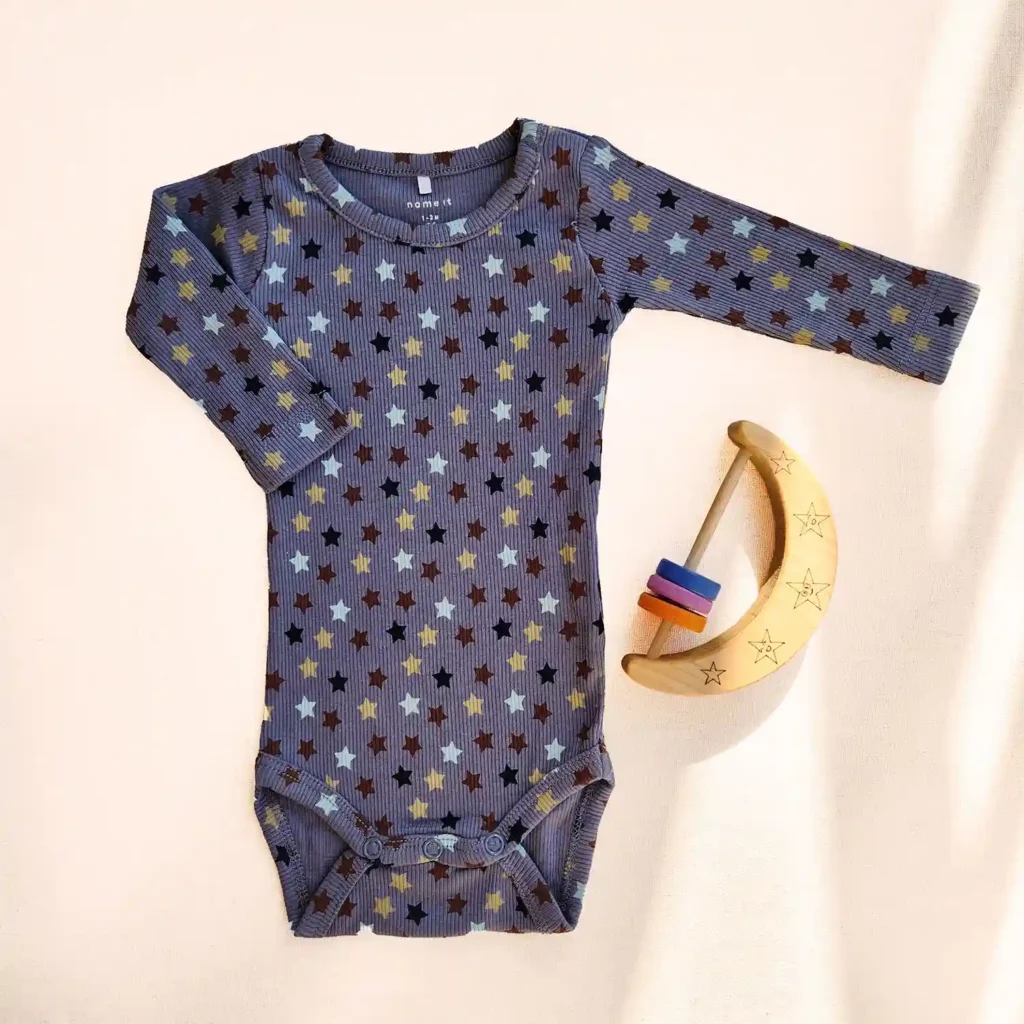 بادی آستین بلند کبریتی طرح ستاره رنگ آبی تیره برند name it