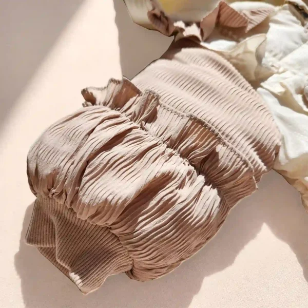 کاپشن سرهمی دخترانه وارداتی اورجینال مدل پاپیونی رنگ کرم نسکافه ای