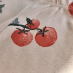 شلوار نوزادی طرح گوجه رنگ کرم