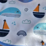 پیشبند نوزادی طرح دلفین و قایق رنگ سفید برند کارترز