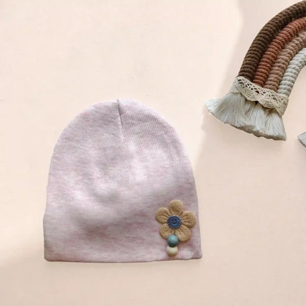 کلاه نوزادی کشبافت مدل گل دکمه ای رنگ صورتی