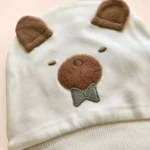 کلاه نوزادی گوشدار طرح تدی رنگ سفید