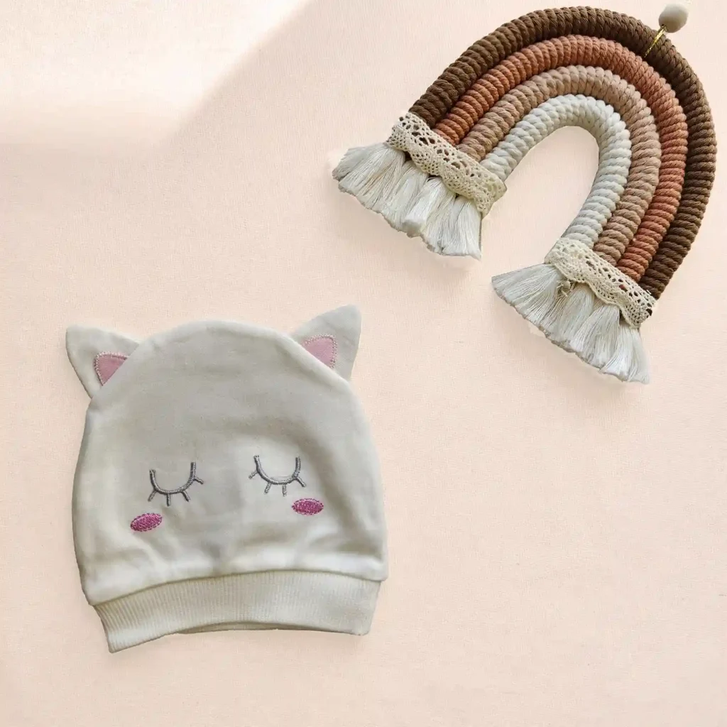 کلاه نوزادی گوشدار طرح چشم رنگ سفید