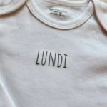 بادی آستین بلند طرح LUNDI رنگ سفید برند ورت بایودت