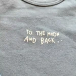 بادی آستین بلند طرح too the moon and back رنگ آبی برند ورت بایودت