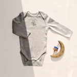 بادی آستین بلند وارداتی طرح تدی رنگ کرم برند C&A