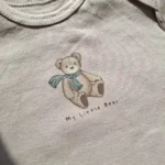 بادی آستین بلند وارداتی طرح تدی رنگ کرم برند سی اند ای