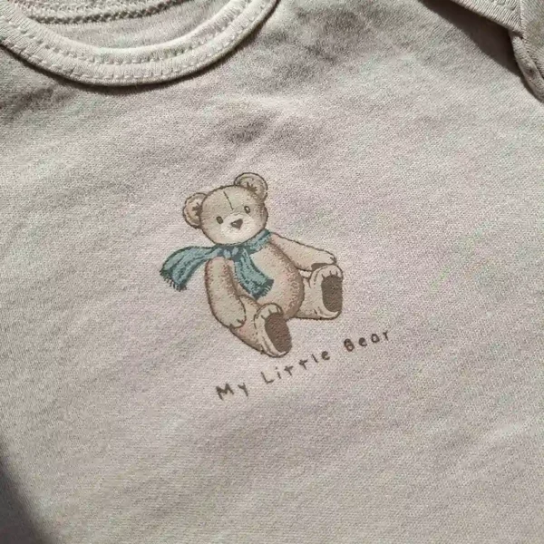 بادی آستین بلند وارداتی طرح تدی رنگ کرم برند سی اند ای