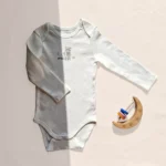 بادی آستین بلند وارداتی طرح راکون کوچولو رنگ سفید برند C&A