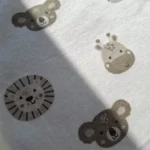 بادی آستین بلند وارداتی طرح شیر و کوالا رنگ سفید برند سی اند ای