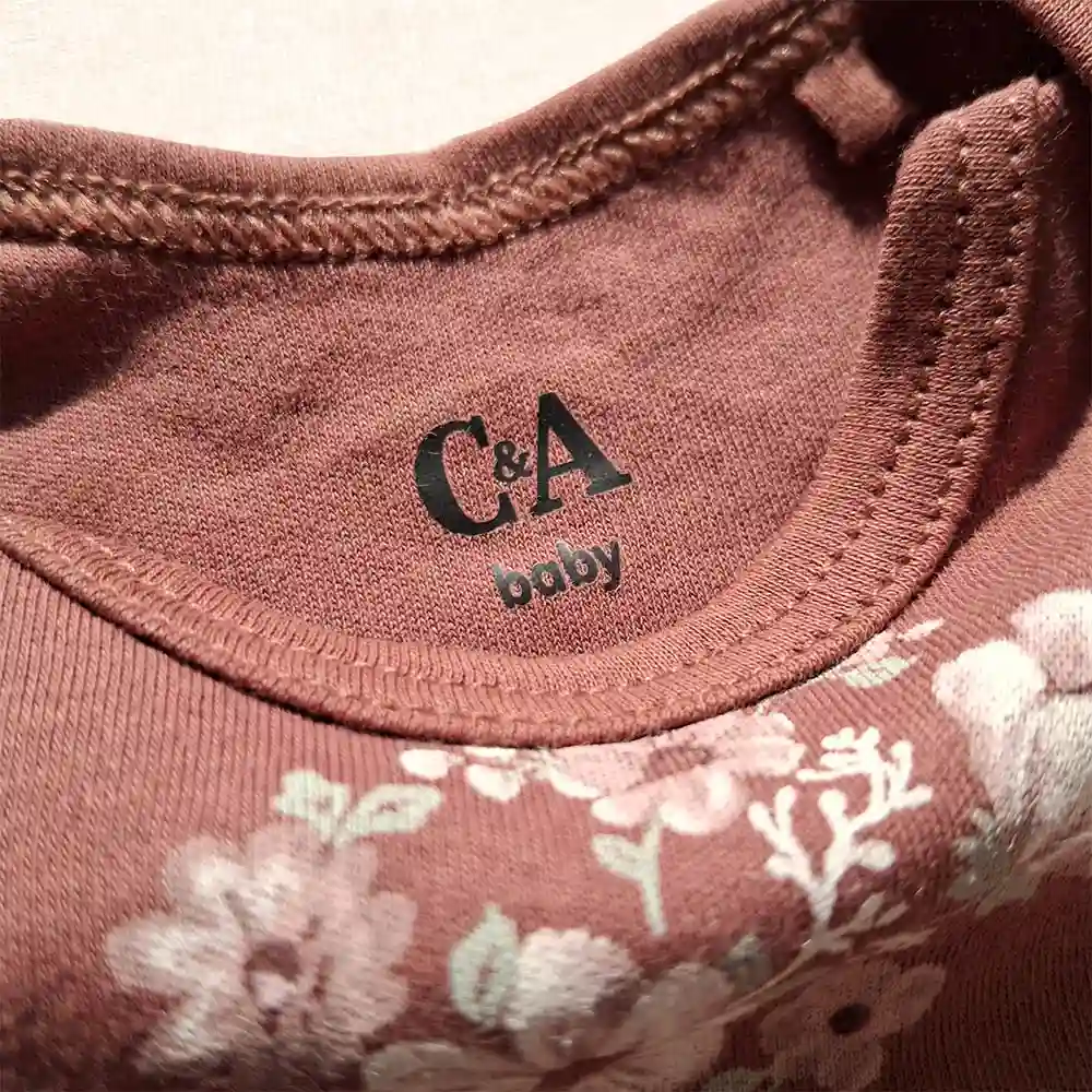 بادی آستین بلند وارداتی طرح گلدار رنگ عنابی برند سی اند ای