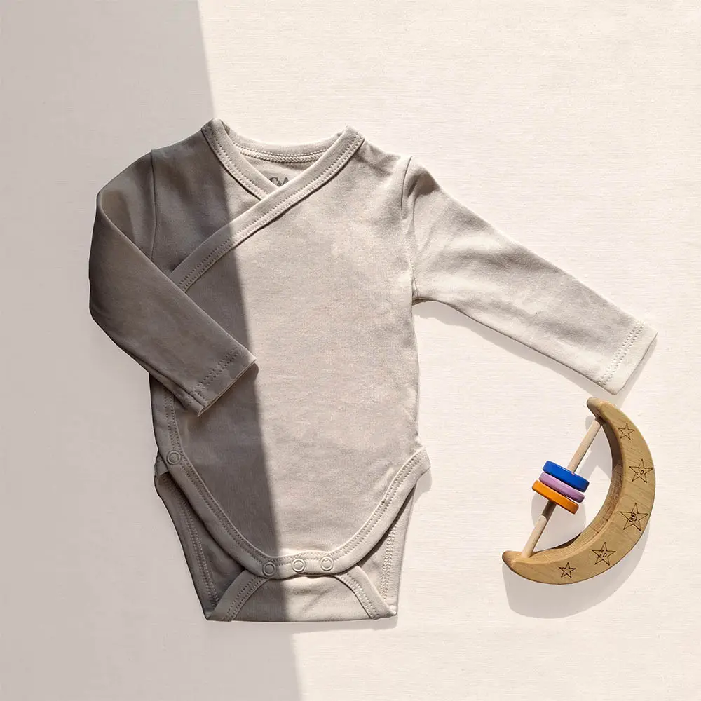 بادی آستین بلند وارداتی یقه هفت ساده رنگ کرم برند C&A