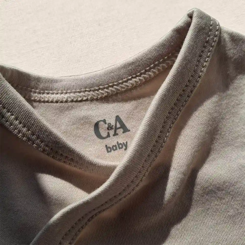 بادی آستین بلند وارداتی یقه هفت ساده رنگ کرم برند سی اند ای