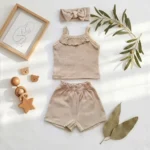 ست 3 تکه وارداتی تاپ و شورتک دخترانه + هدبند رنگ کرم کد 10628