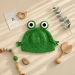 کلاه نوزادی دستبافت طرح قورباغه برند totobaby