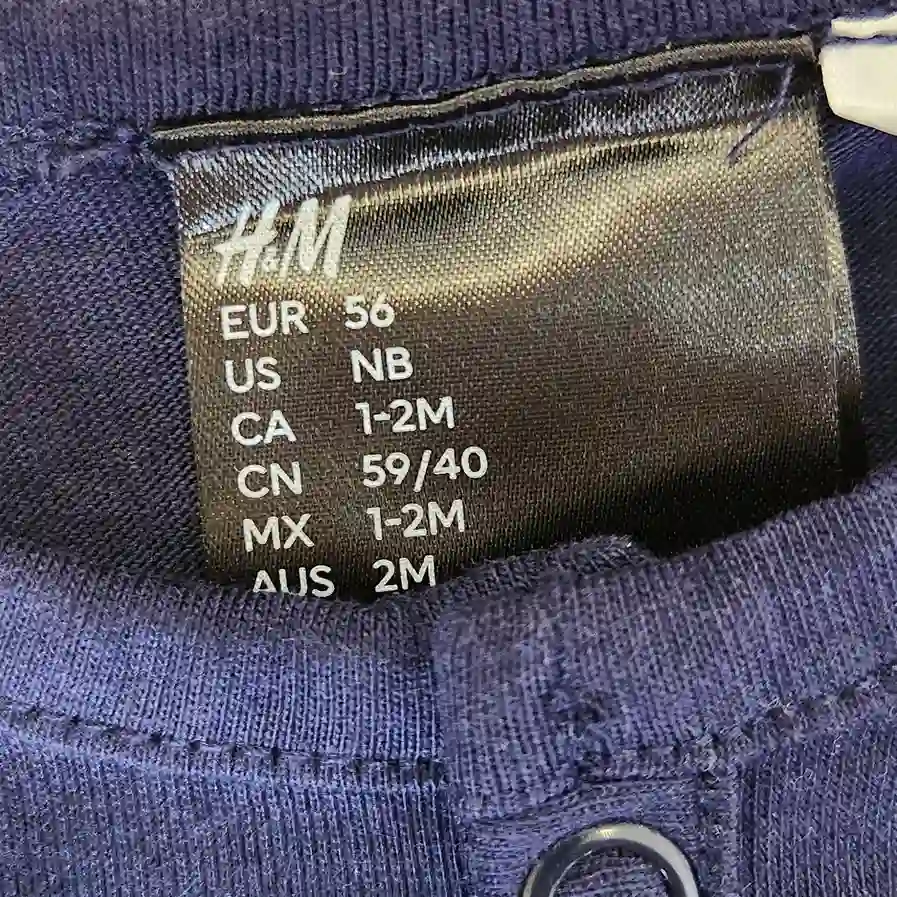 خرید سرهمی نوزادی وارداتی طرح کهکشان رنگ سرمه ای برند H&M